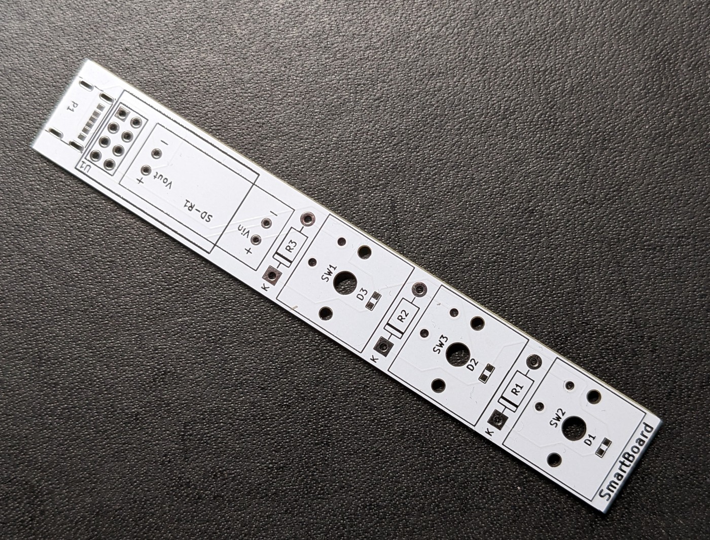 The bare SmartBoard PCB before assembly, showing the three switch footprints and USB-C power section