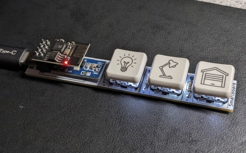 The IoT Keyboard with keycaps etched with lightbulb, lamp and garage door icons